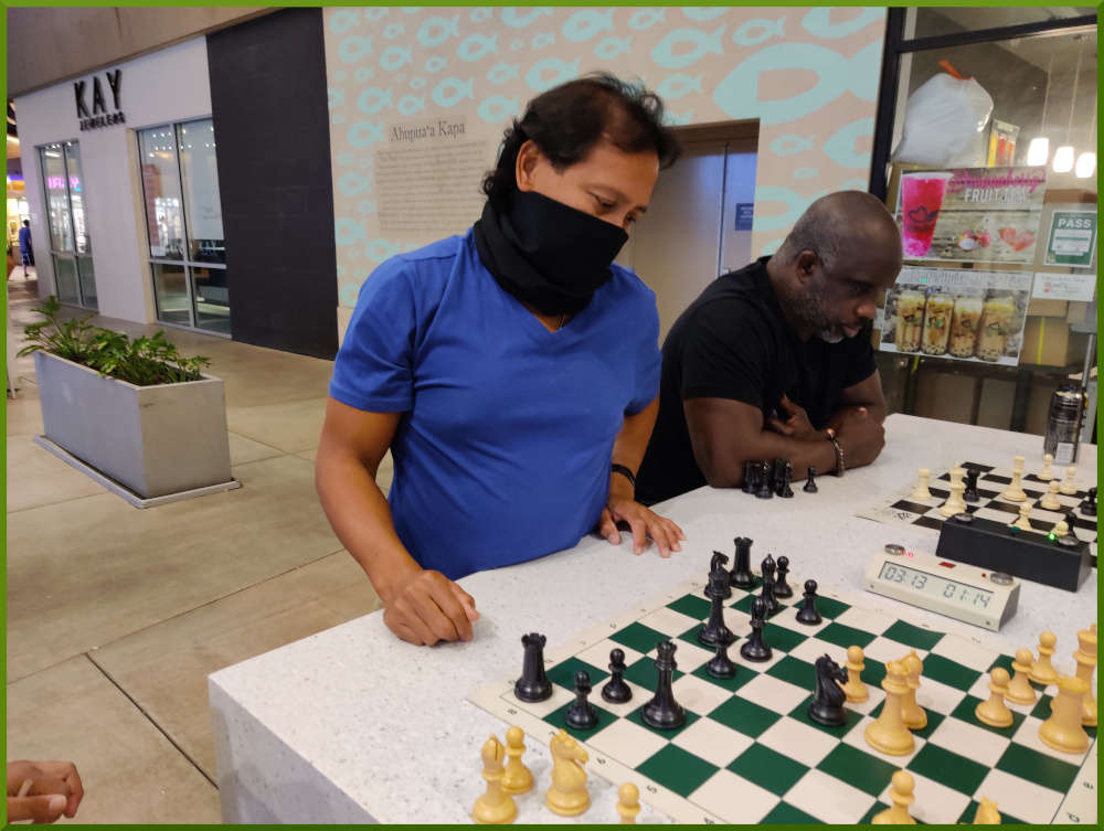 April 13th, 2021. Jimmy is thinking what to move, while on a different board, Ramon waits for his opponent to make a move.
