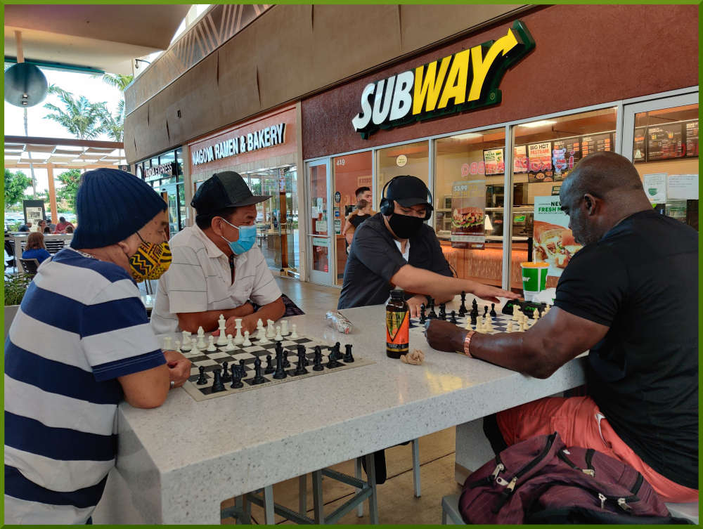 May 4th, 2021. Four individuals playing chess at the Ka Makana Alii foodcourt.