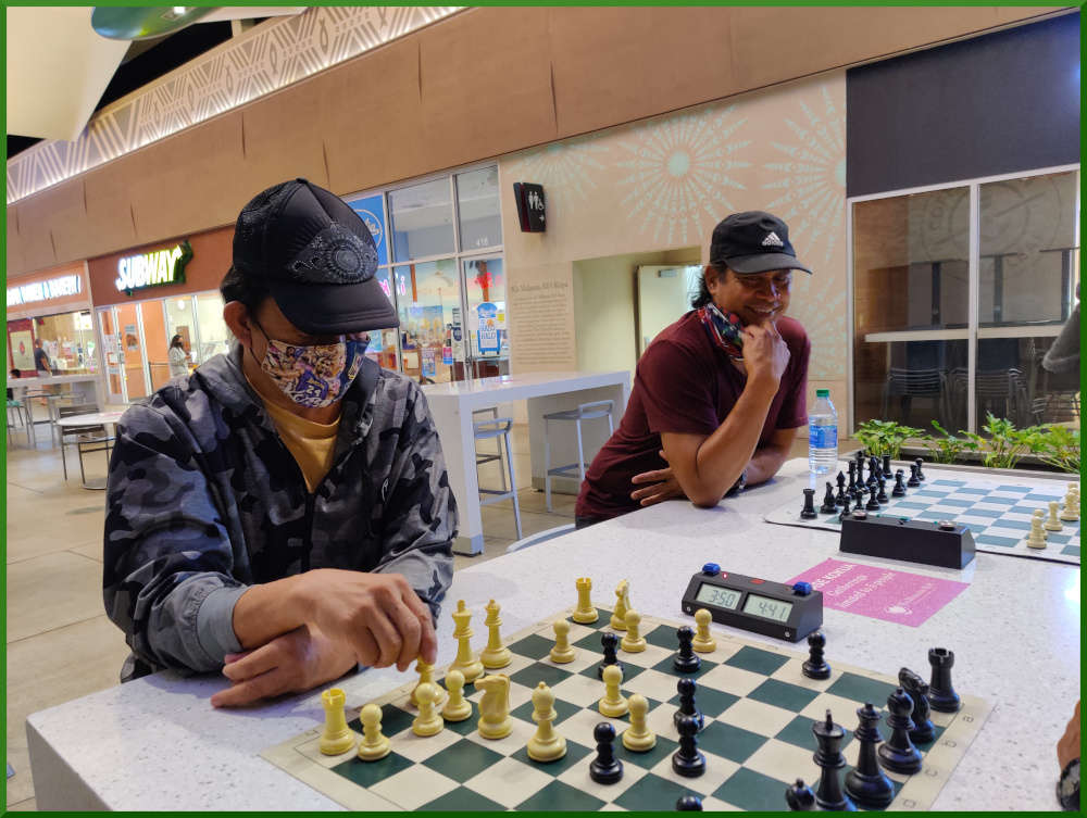 January 12, 2021. Eddie makes a move. James looks on while waiting for an opponent.