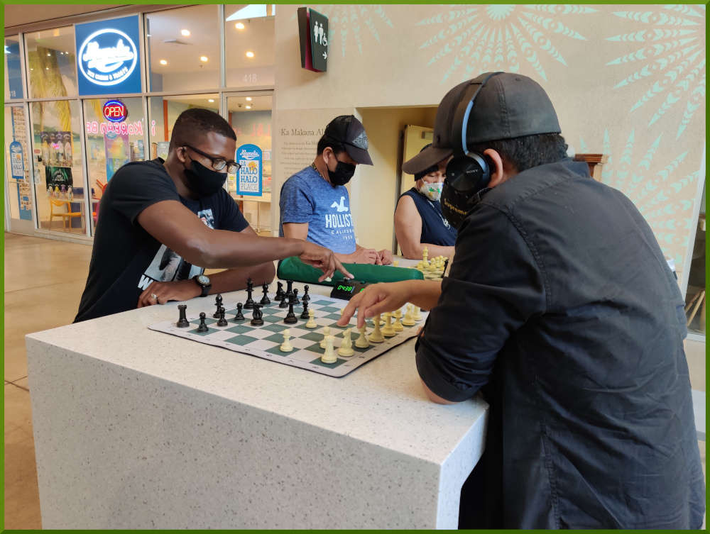 March 2nd, 2021. A few people playing chess at Ka Makana Alii foodcourt.