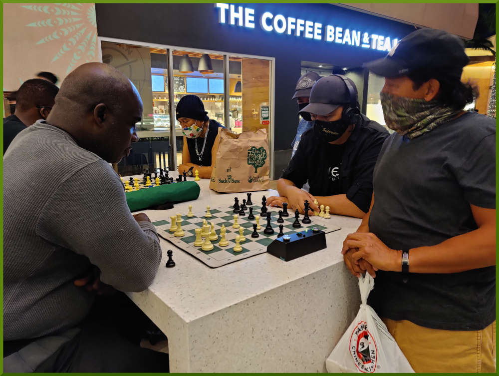 March 2nd, 2021. People playing chess at Ka Makana Alii foodcourt.