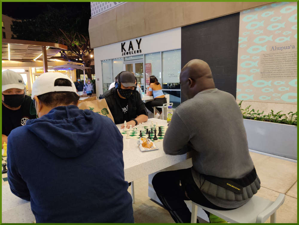 March 2nd, 2021. People playing chess at Ka Makana Alii foodcourt.