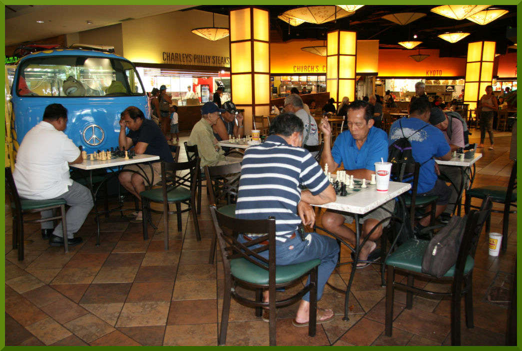 Chess action on four boards