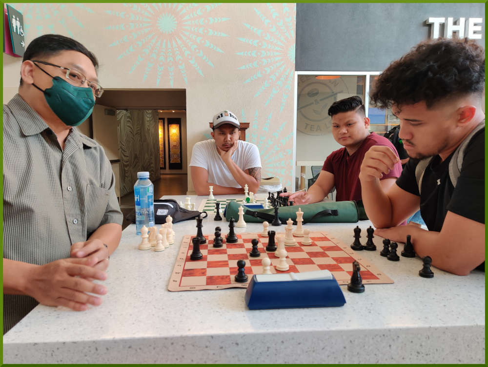 March 29th, 2022. Ka Makana Alii chess meetup. Jose vs Christian. Shane and Prince watching.