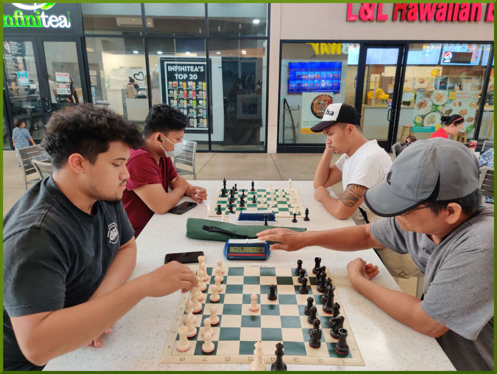 April 19th, 2022. Ka Makana Alii chess meetup. Christian vs Edgar (near board). Prince vs Shane (far board).