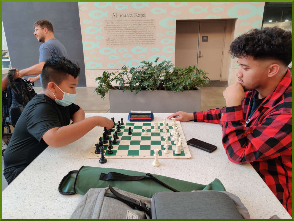 May 10th, 2022. Ka Makana Alii chess meetup. Young boy challenges Christian.