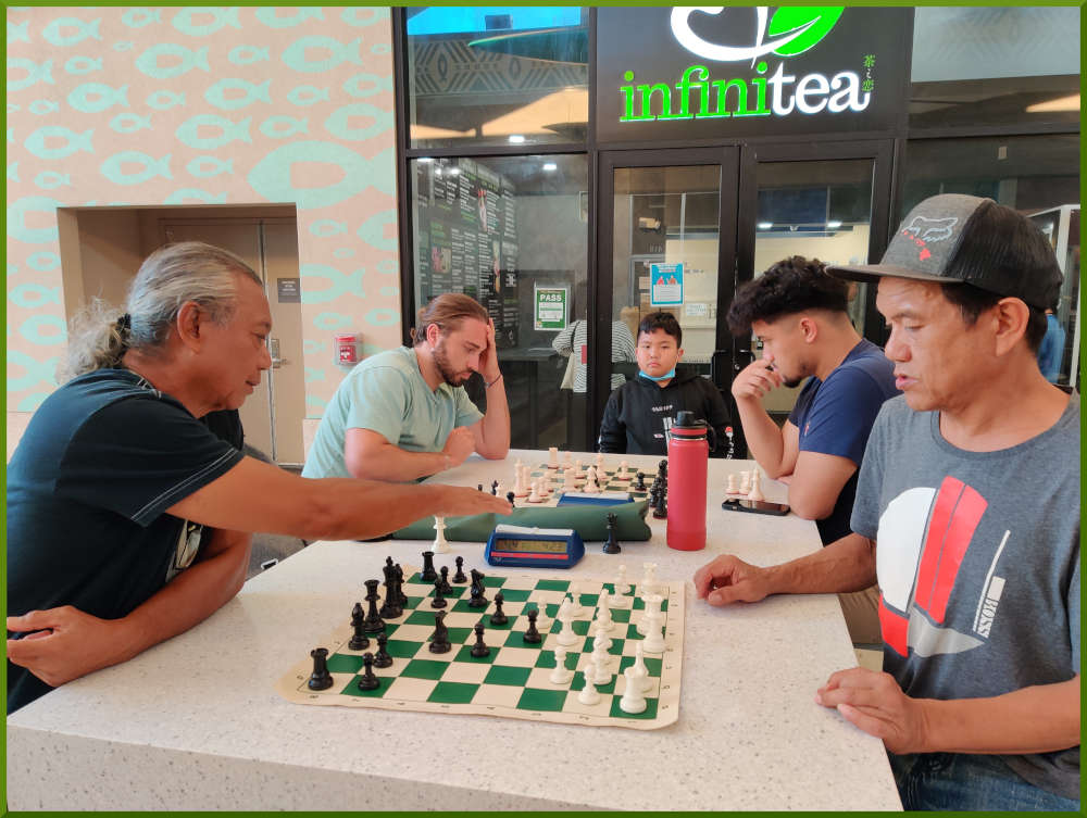 May 17th, 2022. Ka Makana Alii chess meetup. Carlos vs Eddie (near board). Ari vs Christian (far board).