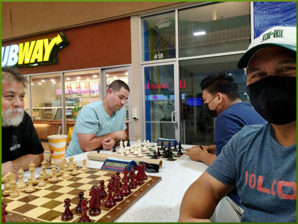 May 17th, 2022. Ka Makana Alii chess meetup. Chet vs Ray (near board). Phil vs Prince (far board).