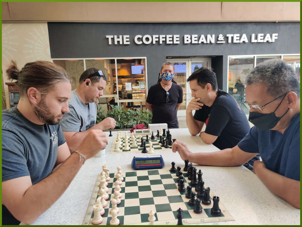 May 24th, 2022. Ka Makana Alii chess meetup. Ari vs Ceasar (near board). Phil vs Ryan (far board).