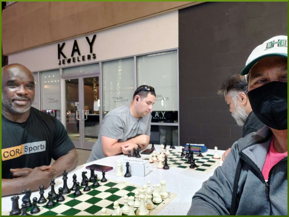 May 24th, 2022. Ka Makana Alii chess meetup. Ramon vs Ray (near board). Phil vs Chet (far board).