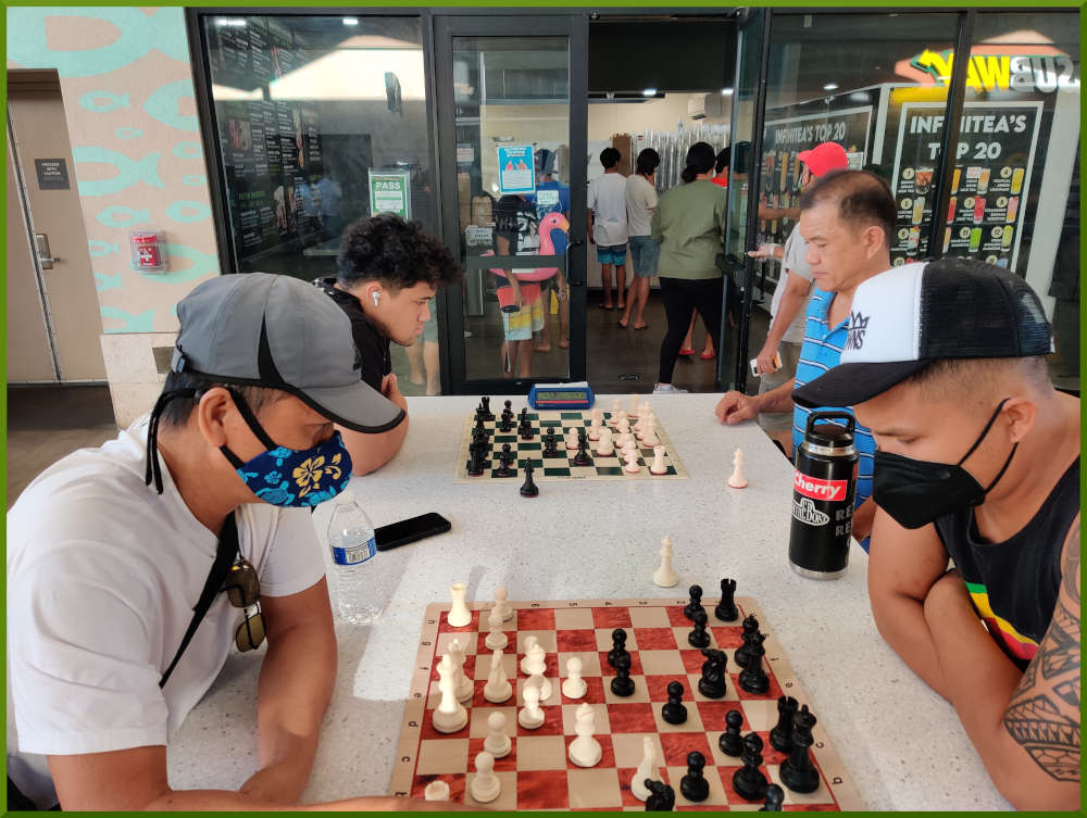 May 31st, 2022. Ka Makana Alii chess meetup. Edgar vs Shane (near board). Christian vs Eddie (far board).