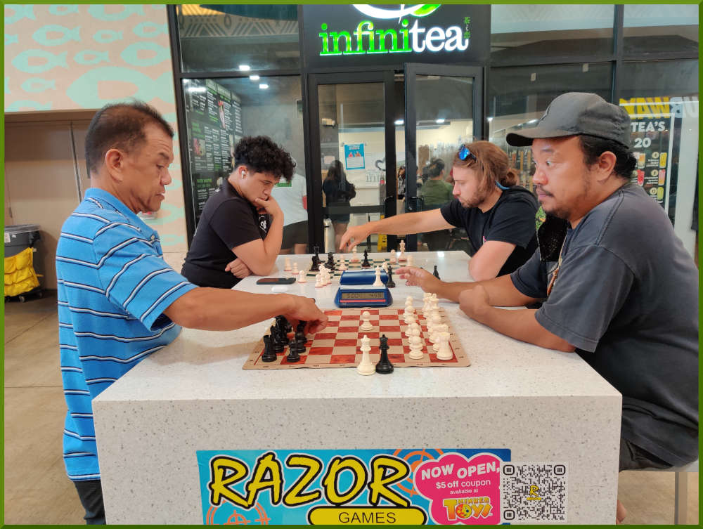 May 31st, 2022. Ka Makana Alii chess meetup. Eddie vs Jeremy (near board). Chrisian vs Ari (far board).