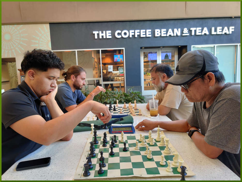 June 28th, 2022. Ka Makana Alii chess meetup. Christian vs Edgar (near board). Ari vs Chet (far board).