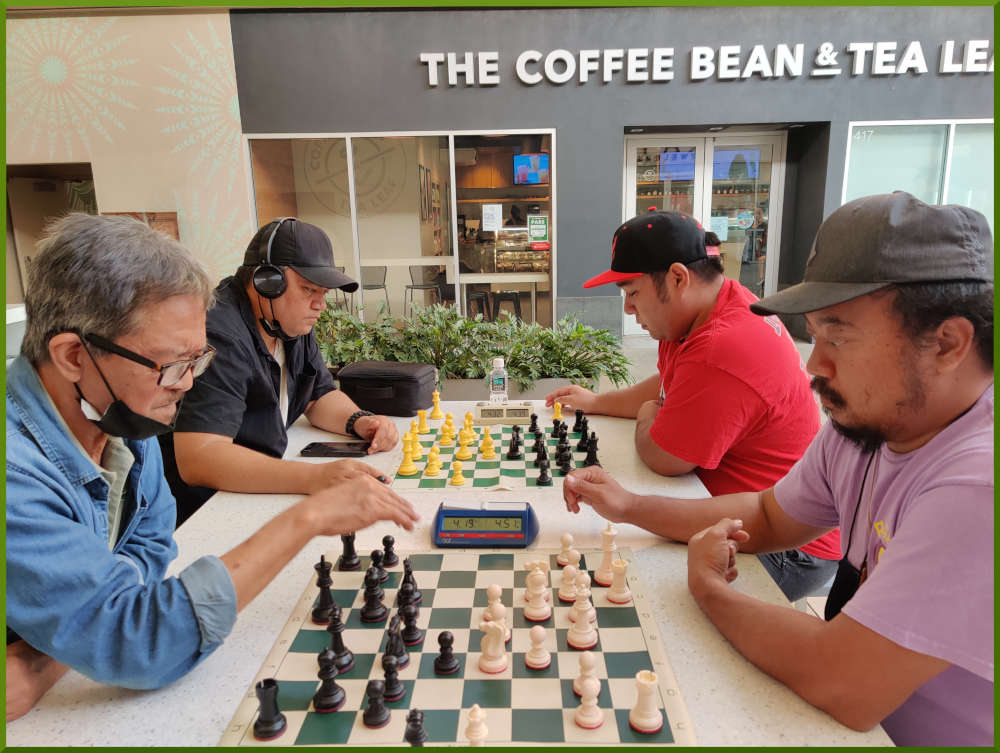 July 12th, 2022. Ka Makana Alii chess meetup. Manny vs Jeremy (near board). Nick vs Ceazar (far board).