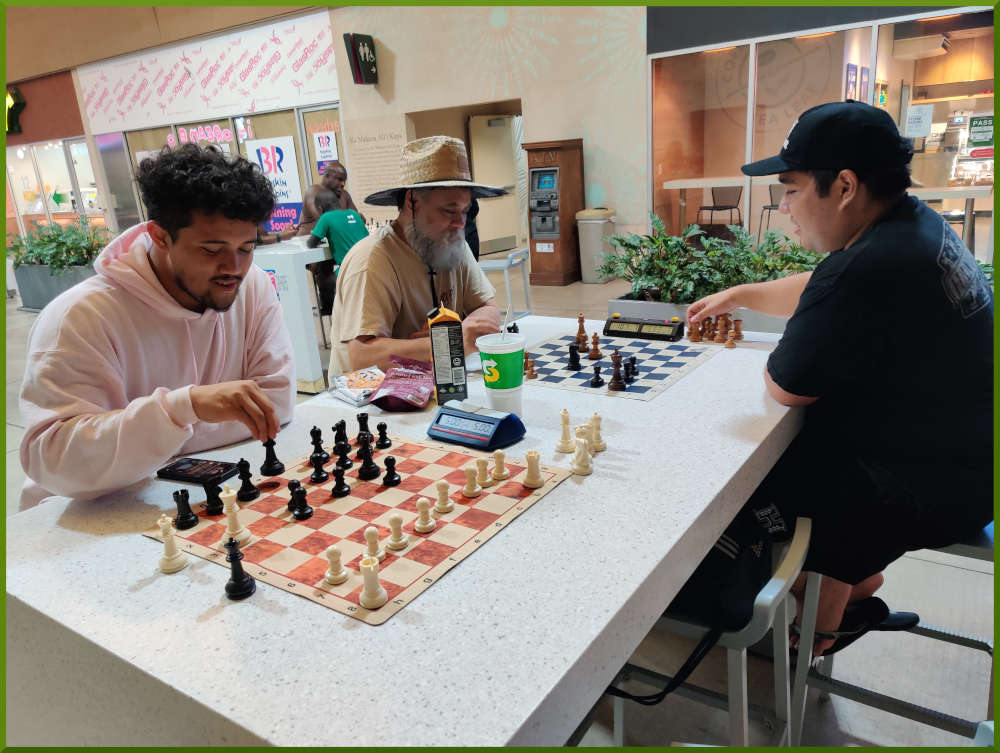 August 30th, 2022. Ka Makana Alii chess meetup. Christian getting ready for a new challenger. Chet vs Ceazar (far board).