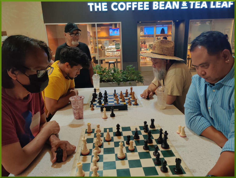 September 13th, 2022. Ka Makana Alii chess meetup. Regie vs Richard (near board). Christian vs Chet (far board).