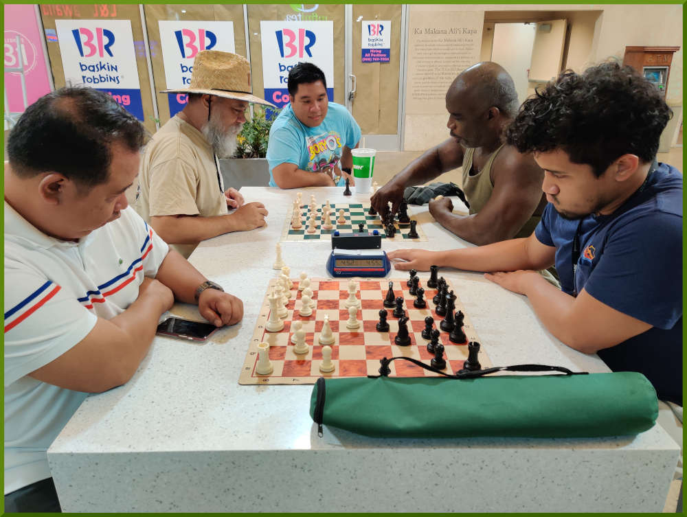 September 20th, 2022. Ka Makana Alii chess meetup. Richard vs Christian (near board). Chet vs Ramon (far board).