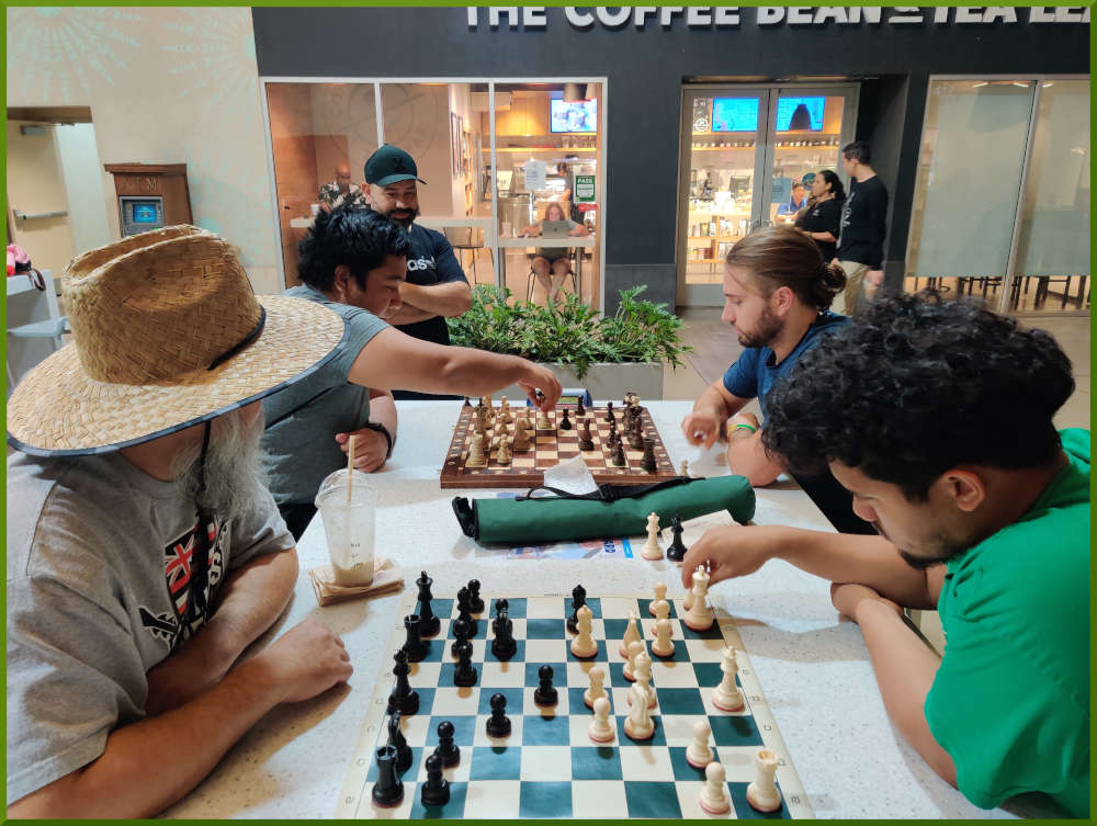 November 8th, 2022. Ka Makana Alii chess meetup. Chet vs Christian (near board). Ceazar vs Ari (far board).