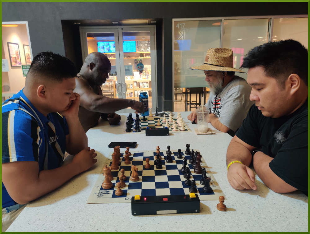 November 22nd, 2022. Ka Makana Alii chess meetup. Prince vs Ceazar (near board). Ramon vs Chet (far board).