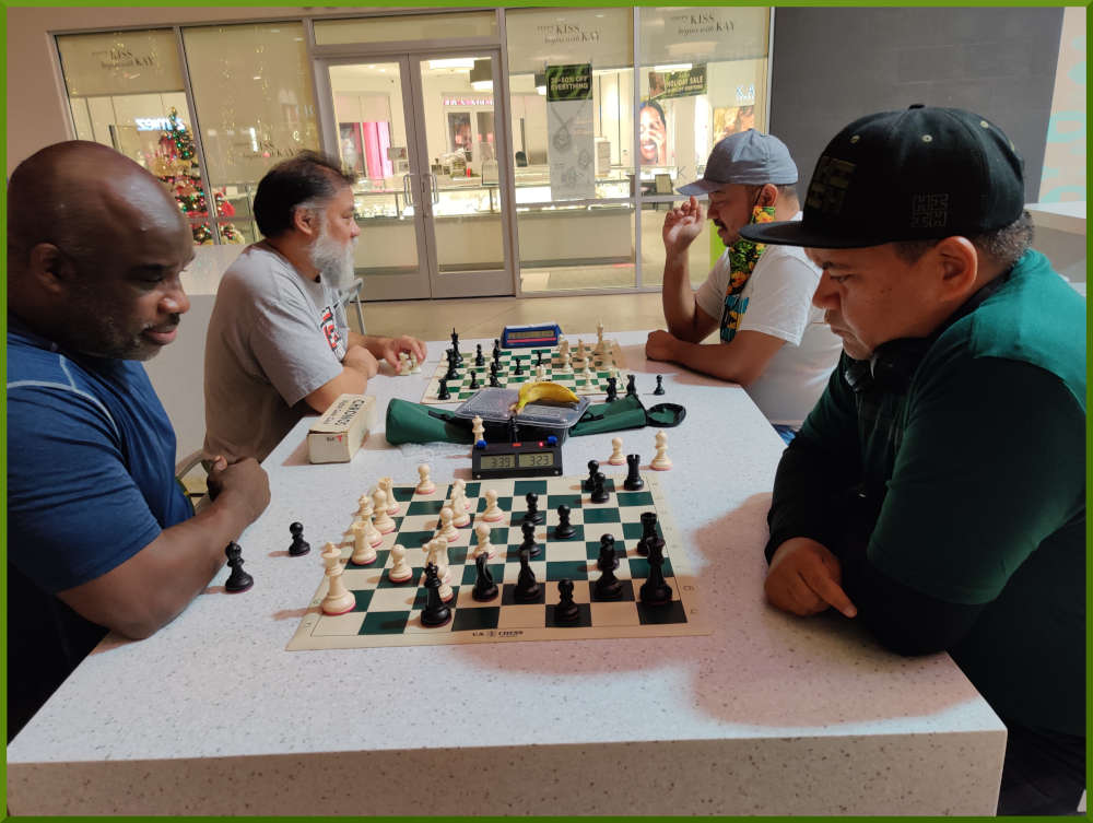 November 29th, 2022. Ka Makana Alii chess meetup. Ramon vs Nick (near board). Chet vs Jeremy (far board).