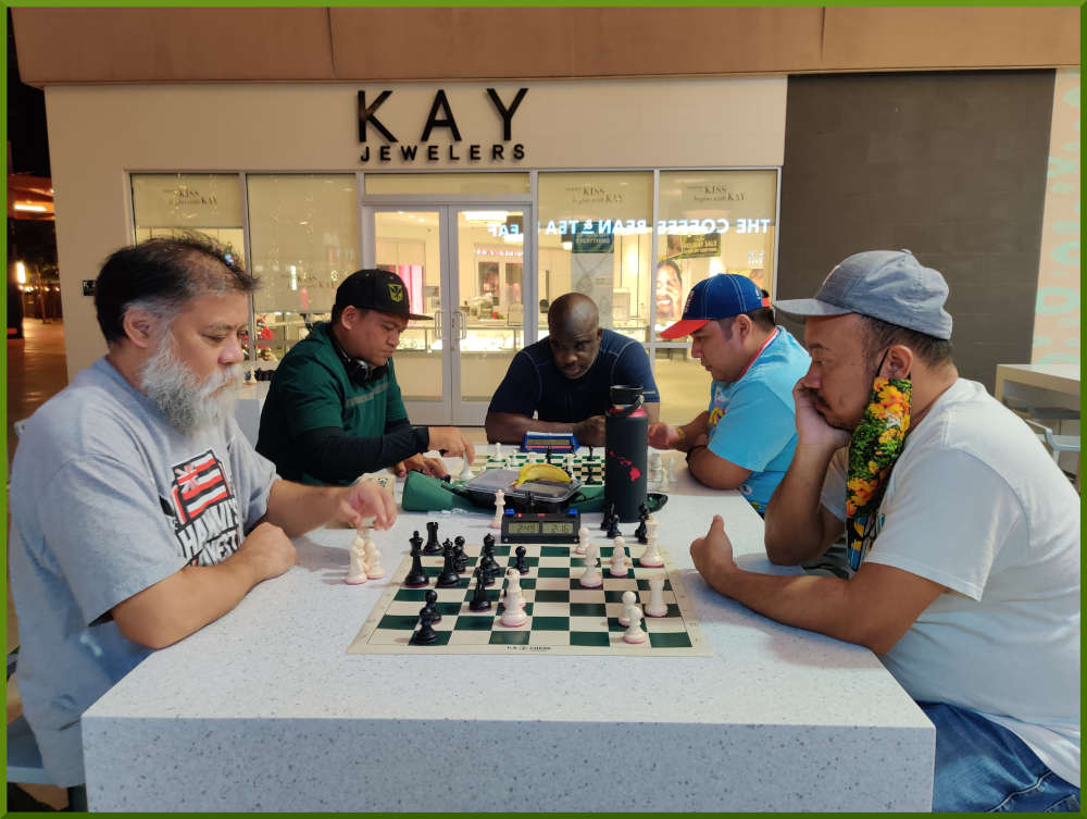November 29th, 2022. Ka Makana Alii chess meetup. Chet vs Jeremy (near board). Nick vs Ceazar (far board).